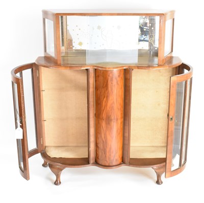 Lot 10 - A 1950s mahogany veneered cocktail cabinet,...
