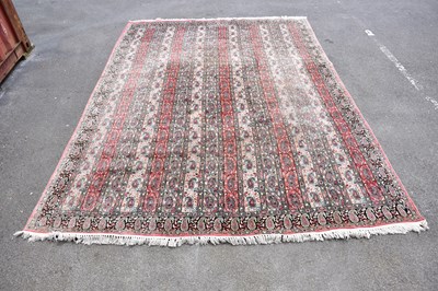 Lot 423 - A large pink ground Eastern style carpet with...