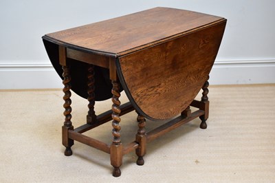 Lot 45 - A 20th century oak gateleg table on barley...