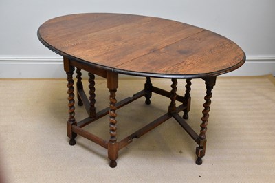 Lot 45 - A 20th century oak gateleg table on barley...