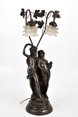 Lot 831 - A modern bronzed figural table lamp with two...