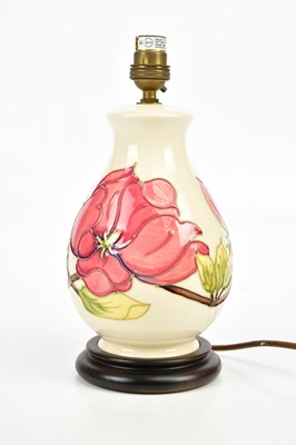 Lot 1377 - MOORCROFT; a baluster shaped table lamp in the...