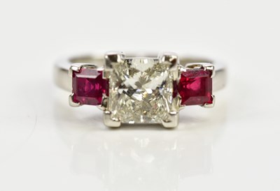 Lot 719 - A platinum diamond and ruby three stone ring,...