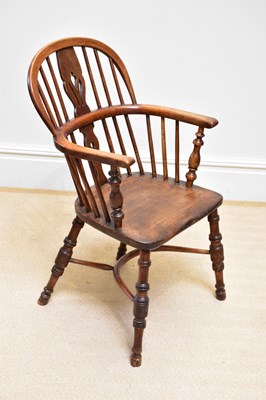 Lot 1212 - A 19th century ash and elm Windsor chair, on...