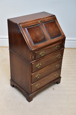 Lot 1079 - A reproduction oak bureau with fall front...