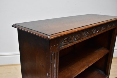 Lot 1080 - A reproduction oak bookcase with two cupboard...