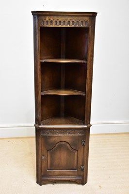 Lot 1112 - A reproduction oak freestanding corner...