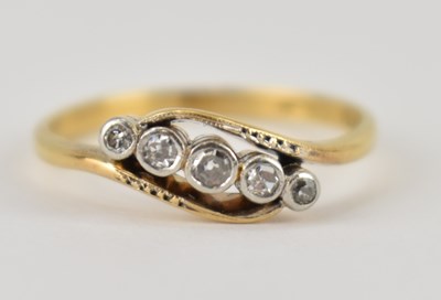 Lot 998 - An 18ct gold ring set with four graduated...