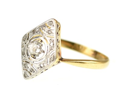 Lot 1030 - An Art Deco yellow metal ring, the...