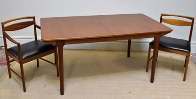 Lot 1014 - A mid century teak extending dining table on...