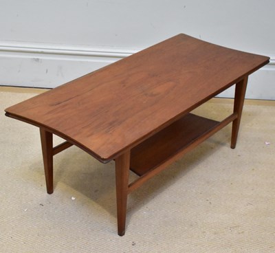 Lot 1023 - A mid century teak coffee table with undertier...