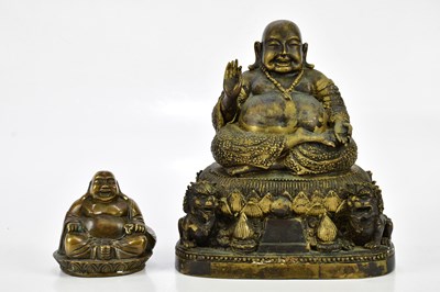 Lot 1197 - A bronzed figure of a seated Buddha and Dogs...