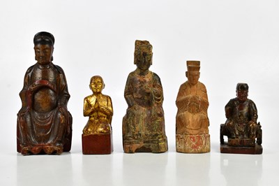 Lot 1203 - A group of five carved wooden painted Chinese...