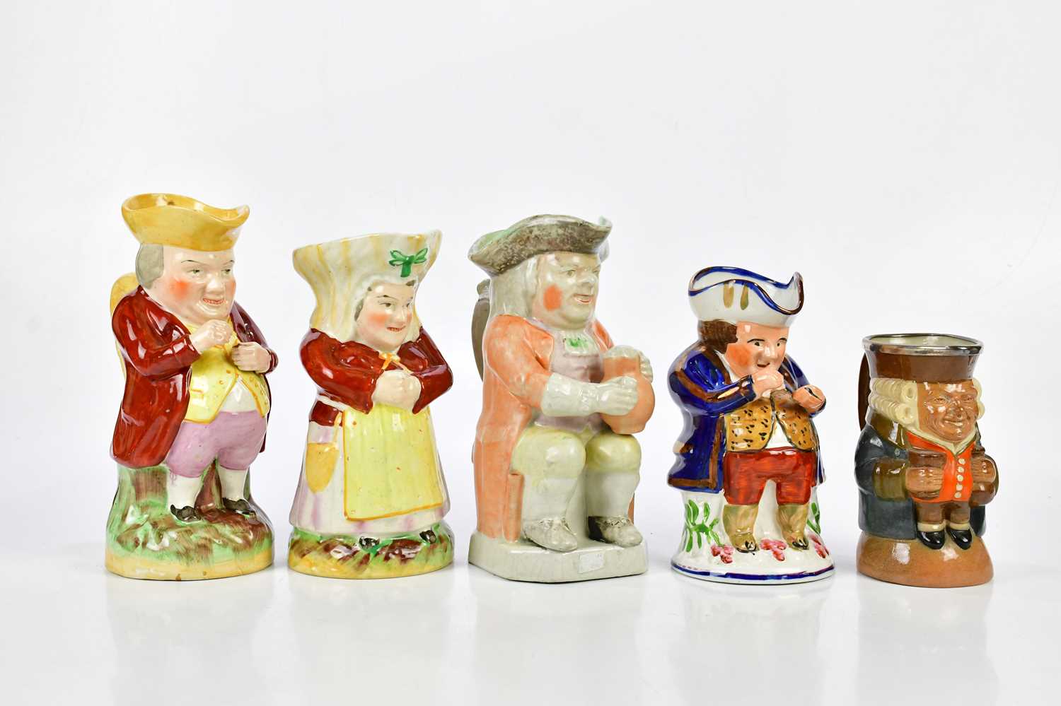 Lot 1431 - A collection of five Toby jugs, one with