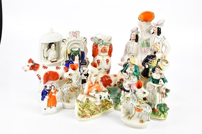 Lot 1545 - A collection of Staffordshire figures to...