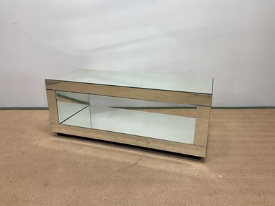 Lot 706 - A mirrored two tier TV stand, height 40cm,...