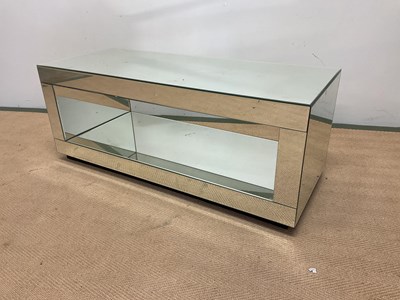 Lot 706 - A mirrored two tier TV stand, height 40cm,...