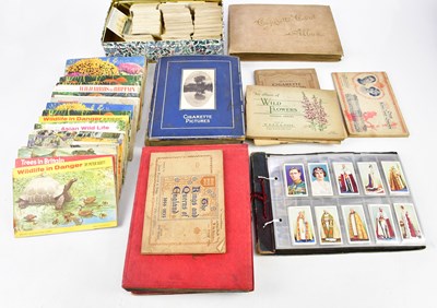 Lot 629 - A collection of cigarette cards, in five...