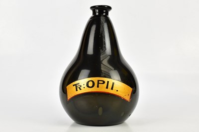 Lot 523 - A Victorian black glass pharmaceutical bottle...