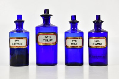 Lot 515 - Four 19th century blue glass pharmacy bottles...