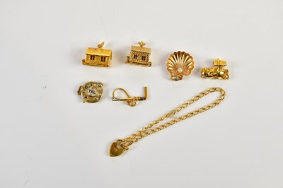 Lot 2514 - A collection of six 9ct gold charms including...