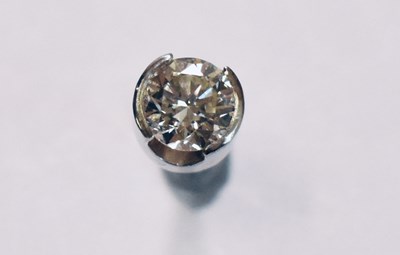 Lot 411 - An 18ct white gold single diamond ear stud,...