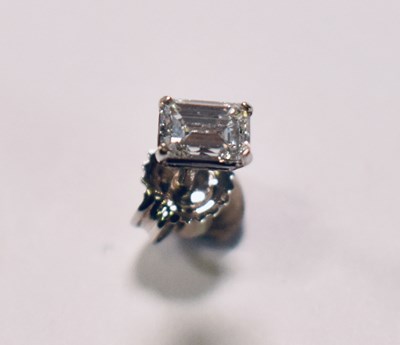 Lot 443 - A white metal single diamond ear stud, the...