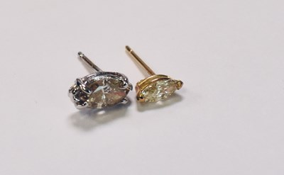 Lot 429 - Two diamond ear studs, both set with marquise...