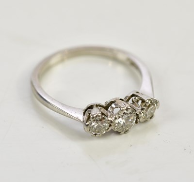 Lot 81 - A platinum and diamond three stone ring, with...