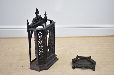 Lot 784 - A cast iron stick stand, decorated with a...