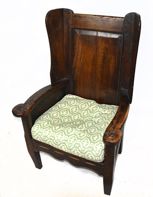 Lot 1512 - A late 18th century oak lambing chair, with...