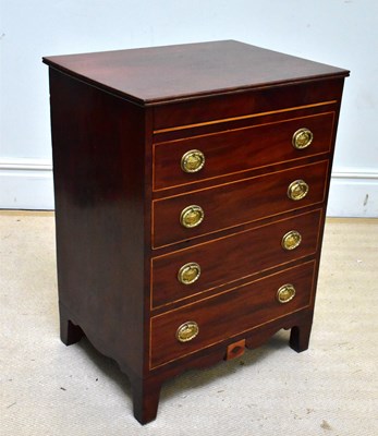 Lot 1270 - A Georgian mahogany inlaid commode chest,...