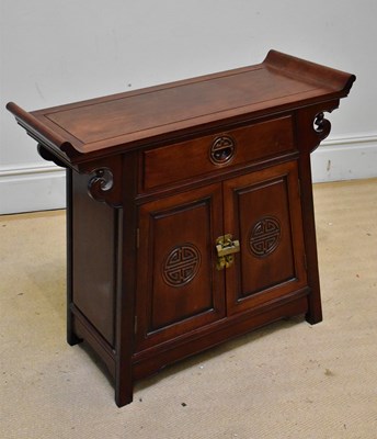 Lot 1110 - A Chinese hard wood side cabinet with single...