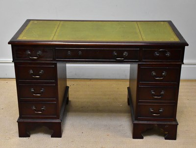 Lot 1111 - A reproduction pedestal desk with an...