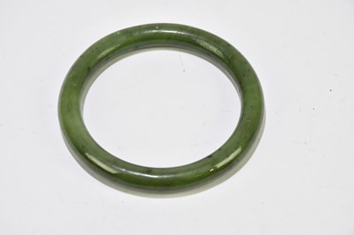 Lot 1282 - Two jade bangles, one diameter 8cm, the other...