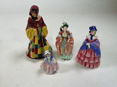 Lot 265 - ROYAL DOULTON; a collection of four figures...