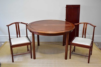 Lot 262 - A Chinese rosewood dining table with three...