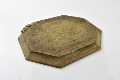 Lot 611 - MOUSEMAN; an oak bread board of canted...