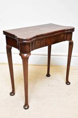 Lot 1262 - A George II mahogany fold-over tea table,...