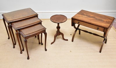 Lot 98 - A 1950s walnut nest of three graduated coffee...