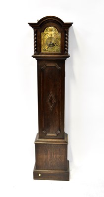 Lot 104 - A 1930s oak cased grandmother clock, the brass...