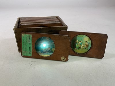 Lot 5 - Four magic lanterns in metal cases with a box...