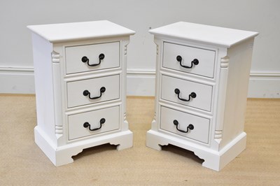 Lot 272 - A pair of modern cream three drawer bedside...