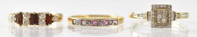 Lot 1028 - Three 9ct yellow gold rings, comprising an...
