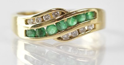 Lot 1016 - A 14K yellow gold crossover ring set with...
