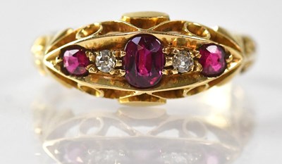Lot 1002 - An 18ct yellow gold ring set with three rubies...