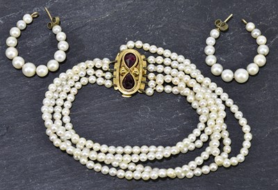 Lot 1276 - A five row cultured pearl bracelet set with...