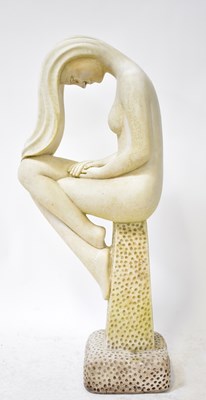 Lot 75 - A garden statue modelled as a woman sitting on...