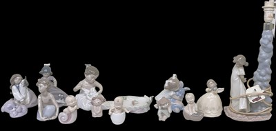 Lot 610 - LLADRO AND NAO; a group of assorted figures,...