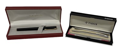 Lot 385 - PARKER; a stainless steel fountain pen, a...